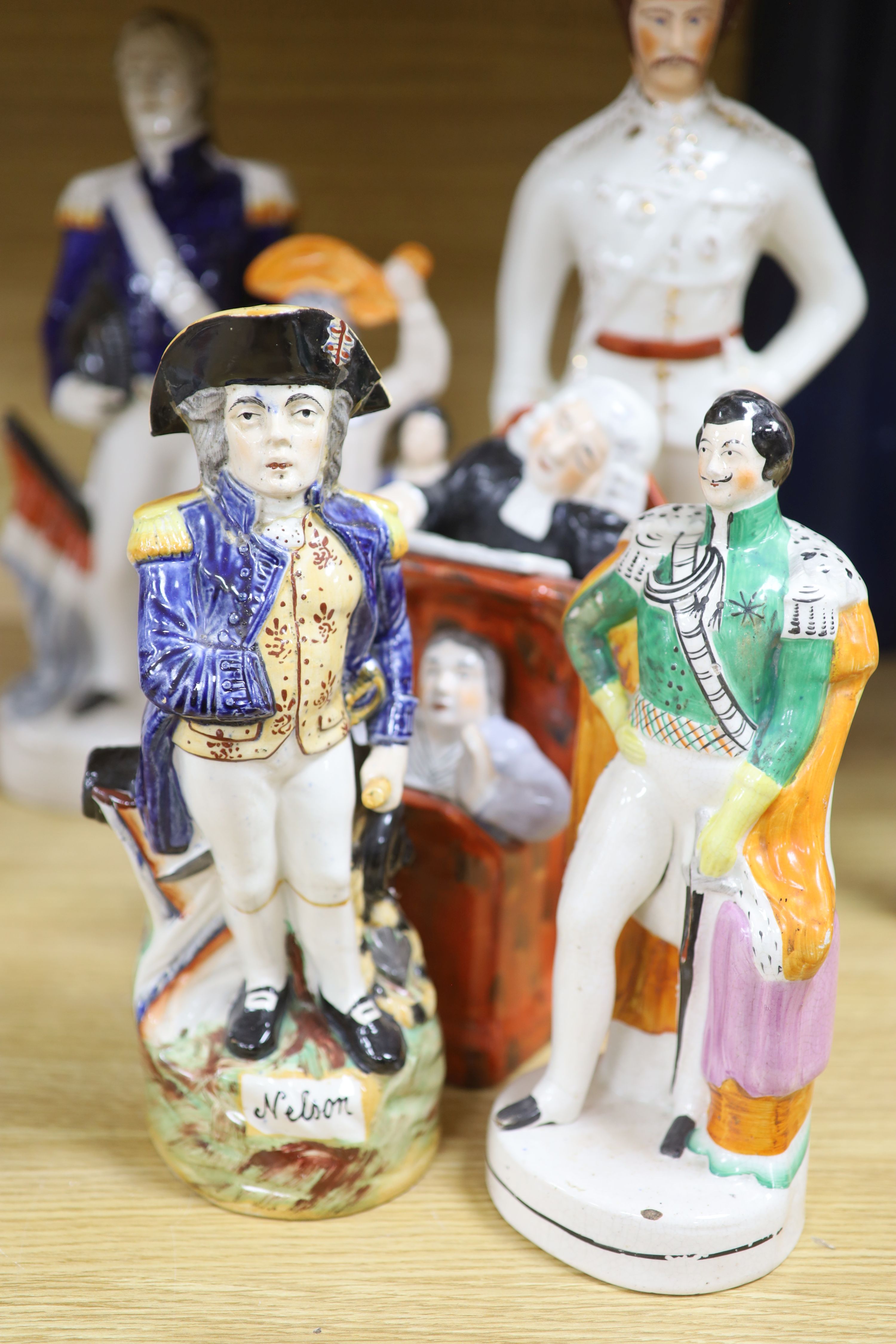 Eight 19th century Staffordshire flatbacks, tallest 42cm